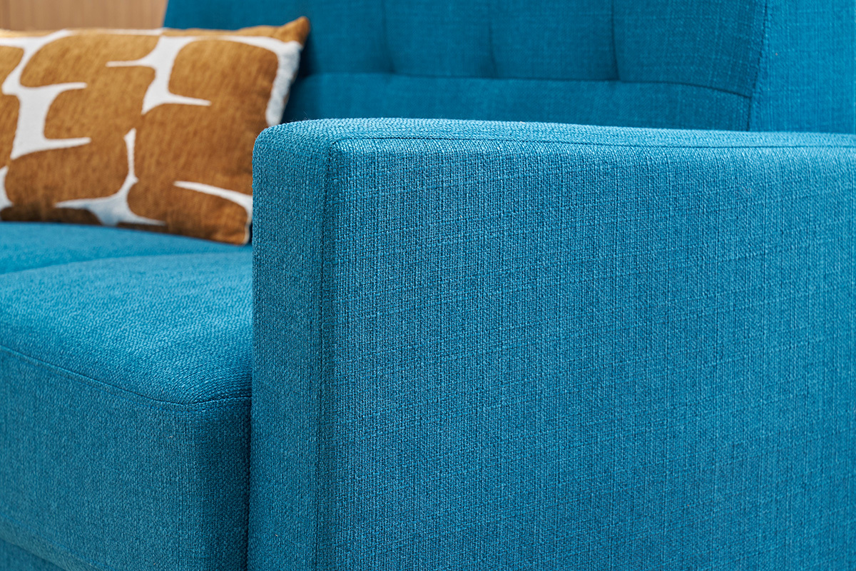 Canap� scandinave bleu canard avec coussin, vue rapproch�e lat�rale.