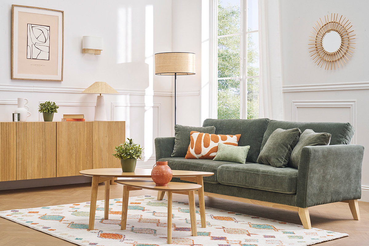 Canap� scandinave vert kaki, trois places, en tissu effet velours, pieds en bois clair, avec coussins.