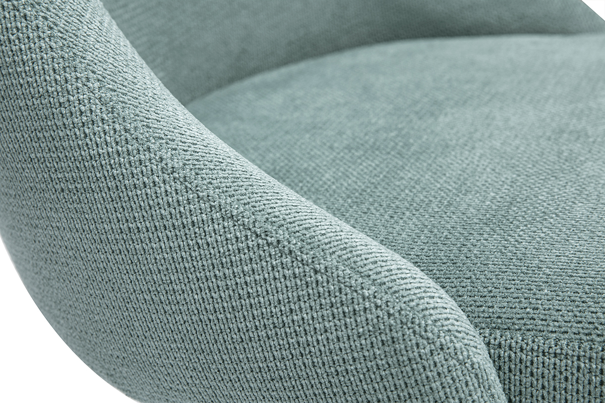 Gros plan sur le tissu vert c�ladon textur� effet velours d'une chaise scandinave.