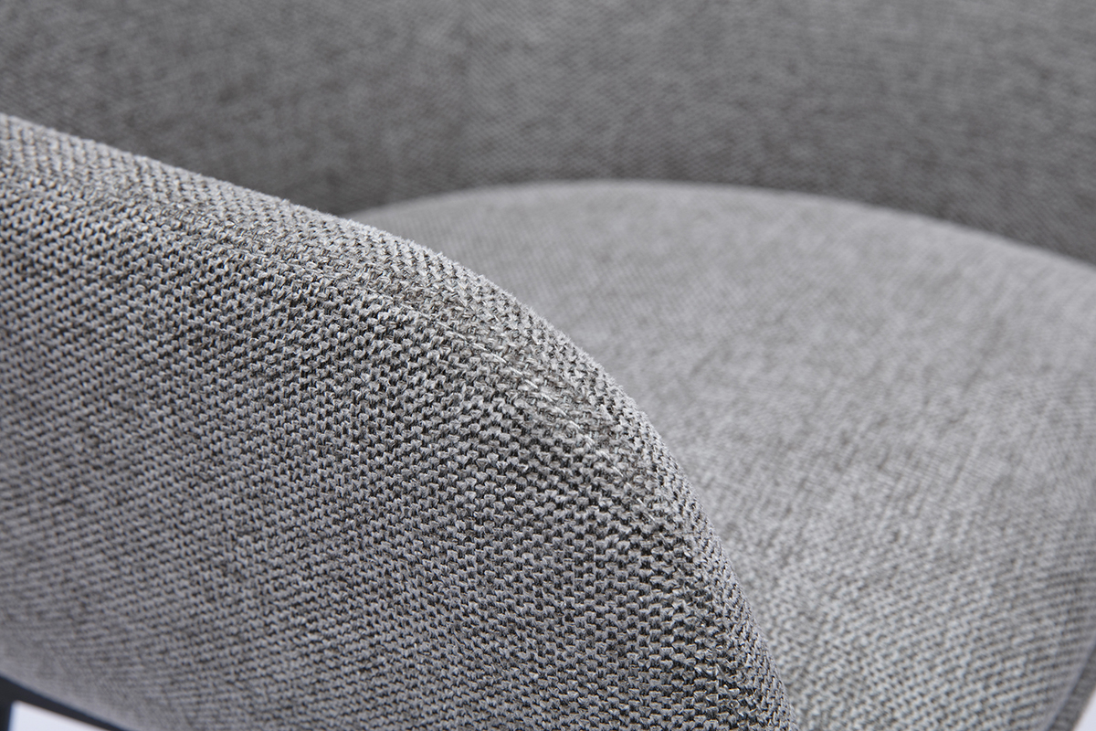 Gros plan d'un fauteuil en tissu gris textur�.