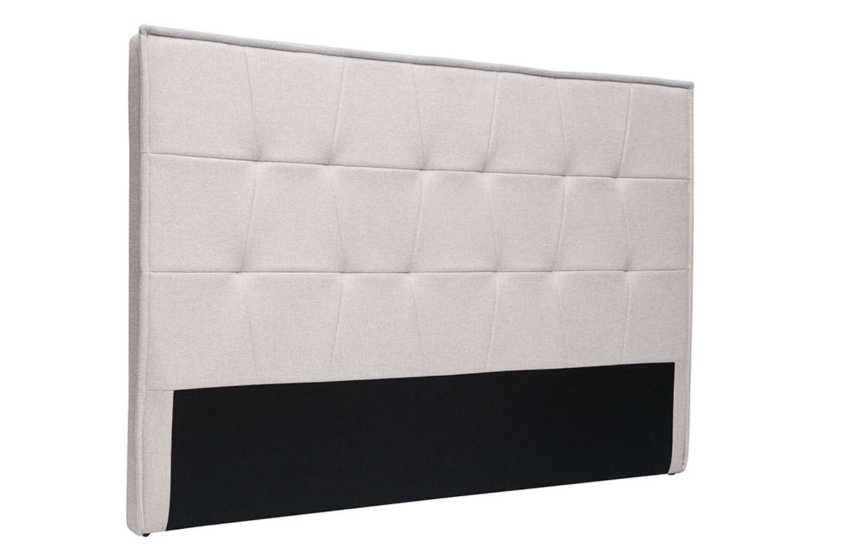 T�te de lit beige effet velours textur� avec capitons, vue de trois quarts.